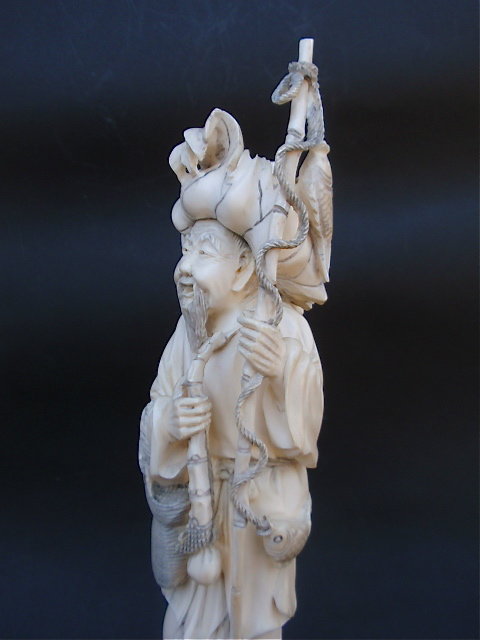 Chinese Ivory carved figure of a fisherman