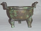 A Rare Zhou Dynasty Bronze Ding Vessel with Archaic Motifs