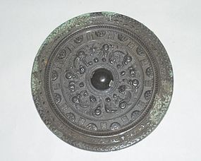 A Rare Bronze Mirror with Archaic Motifs