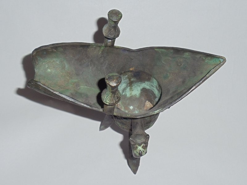 A Massive Zhou Dynasty Bronze Jue Wine Vessel with Archaic Motifs