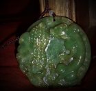 An Exquisite Qing Dynasty Green Jade Pedant with Auspicious Reliefs