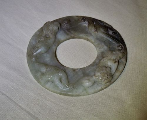A Rare Jade Disc Carved on Both Sides with Chi-Dragon Motifs