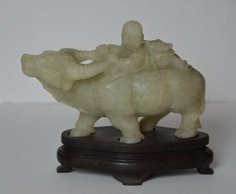 A Rare Jade Sculpture of a Boy Cowherd Riding a Buffalo