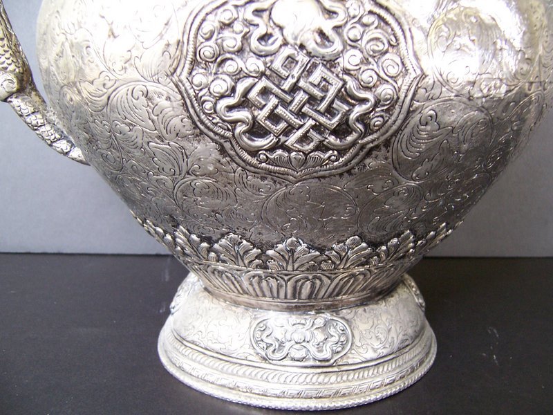 A Tibetan Ewer with Repousse Work and Makara Handles