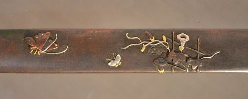 Kozuka in sentoku inlaid with buterflies in gold and silver