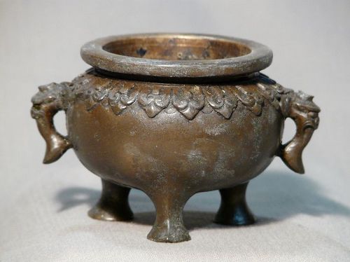 Small Chinese or Japanese cast bronze tripod censer.