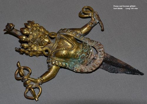 Gilded bronze Phurba handle formed by an human bust