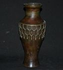 Cast bronze vase inlay with gold and silver.