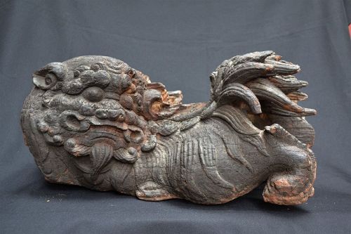 Pair of Buddhist Lions in carved wood.