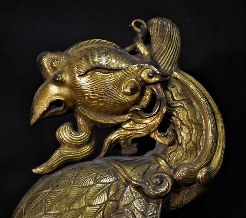 Phoenix-shaped handle, gilded bronze.