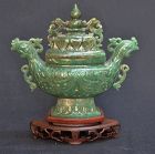 Green jade covered censer vase.