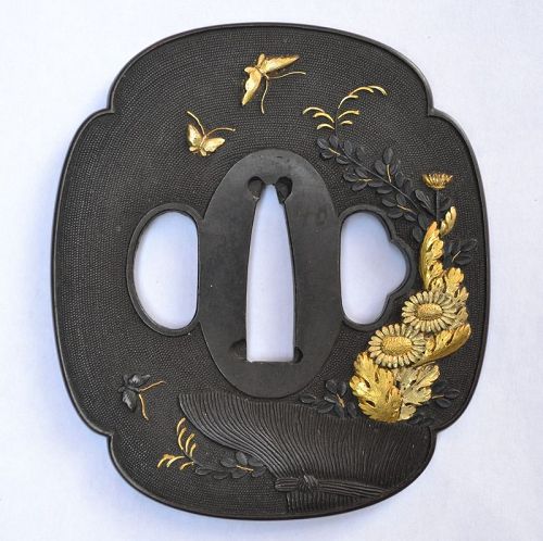 Tsuba in shakudo and gold. Basket and flowers.