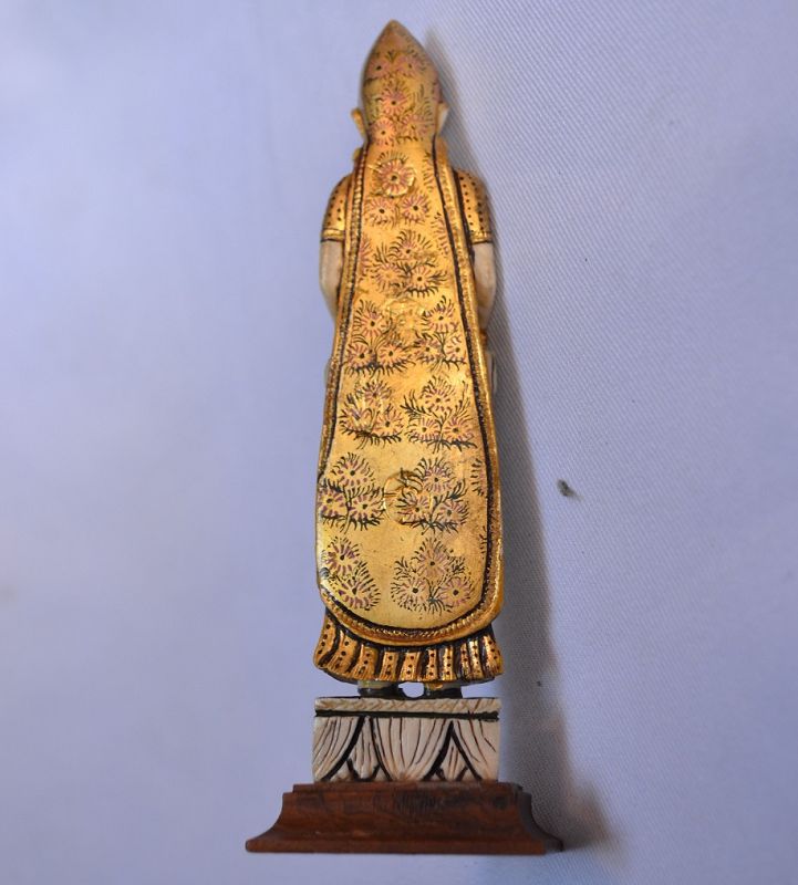 Indian musician carved bone gilded.