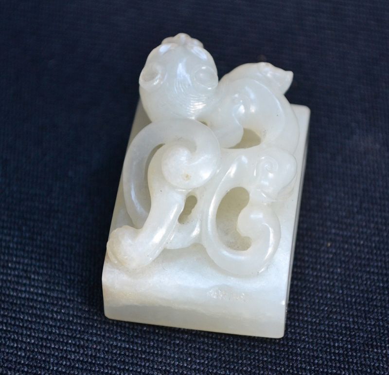 Chinese jade buckle cut with a grinding wheel, representing a dragon