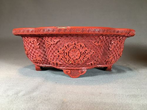 Pair of carved cinnabar lacquer cups. China 18th century.