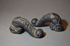 Cast bronze cannon handles, representing 2 dragons.Chinese Ming period