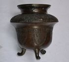 Large tripod incense burner in cast bronze inlaid with silver 19th