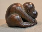 Carved wooden monkey. Signed netsuke. Edo period Japan.
