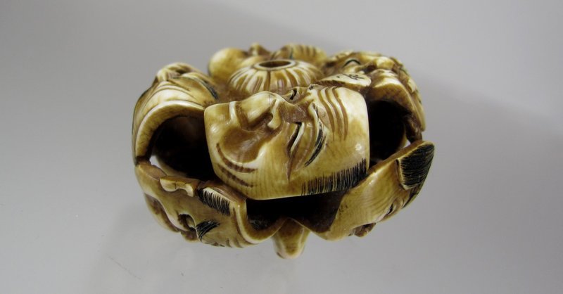 KOICHI, 19th C. Japanese Nine-Mask Group Netsuke