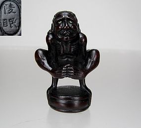 RYOMIN, 19th C. Japanese Wood Netsuke: Acrobat over Mitsu-Tomoe Disk