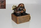 TOMOCHIKA, Japanese Mixed Materials Netsuke: Okame performing Mamemaki