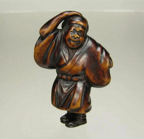 Late 18th Century Japanese Wood Netsuke, Merchant