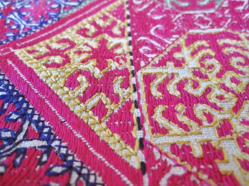 A finely embroidered pillow cover from Hazara, Pakistan