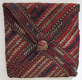 A small embroidered silk purse from Ghazni province