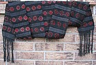 A vintage Tibetan wool sash depicting tigma motifs