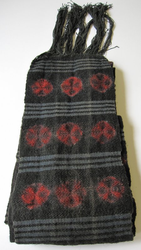 A vintage Tibetan wool sash depicting tigma motifs