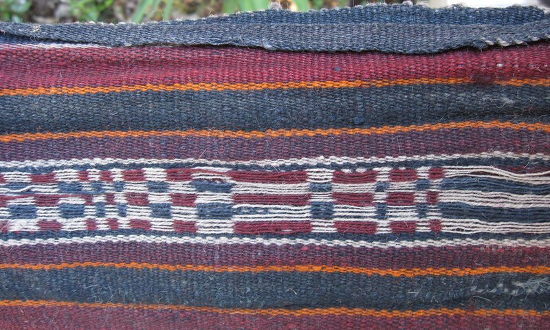 A striped woven wool sash from Tibet