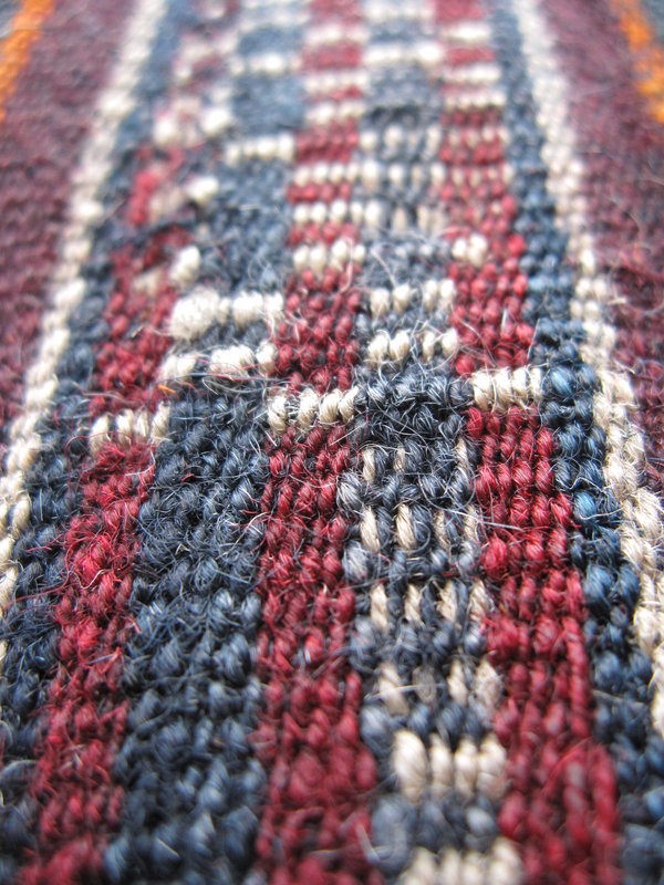 A striped woven wool sash from Tibet