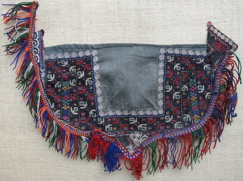A vintage Turkmen Tekke silk embroidered child's bib