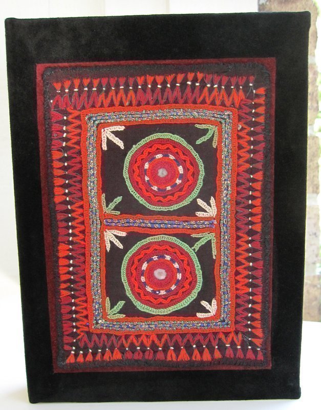 A handmade suede journal with Afghan embroidery