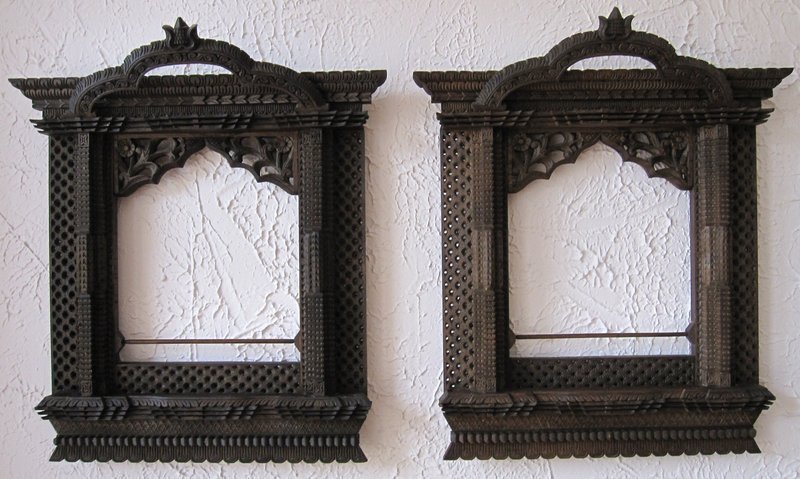 A pair of hand-carved window frames from Nepal