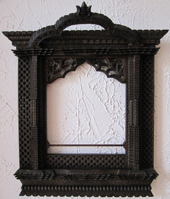 A pair of hand-carved window frames from Nepal