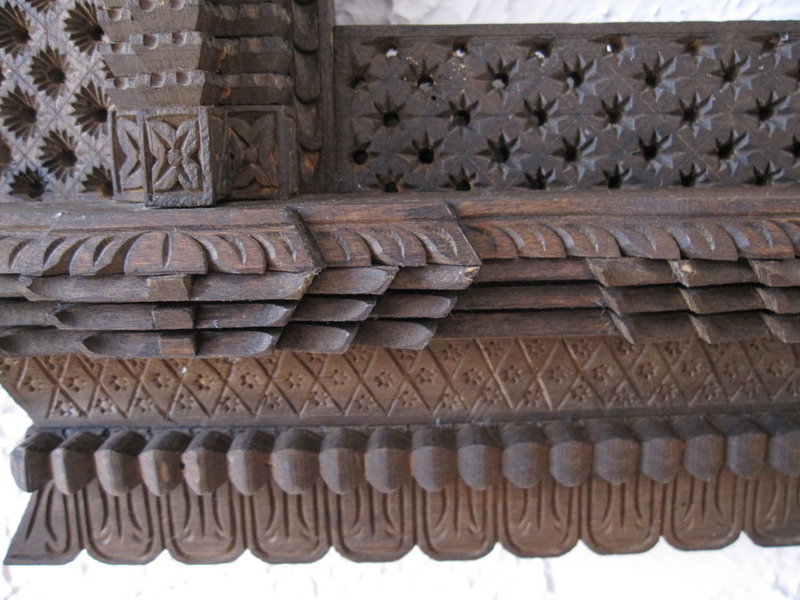 A pair of hand-carved window frames from Nepal