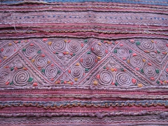 A vintage Hmong textile cushion cover