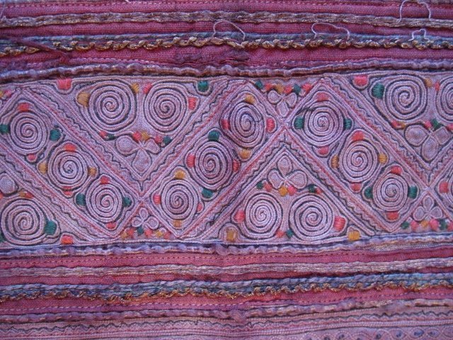 A vintage Hmong textile cushion cover