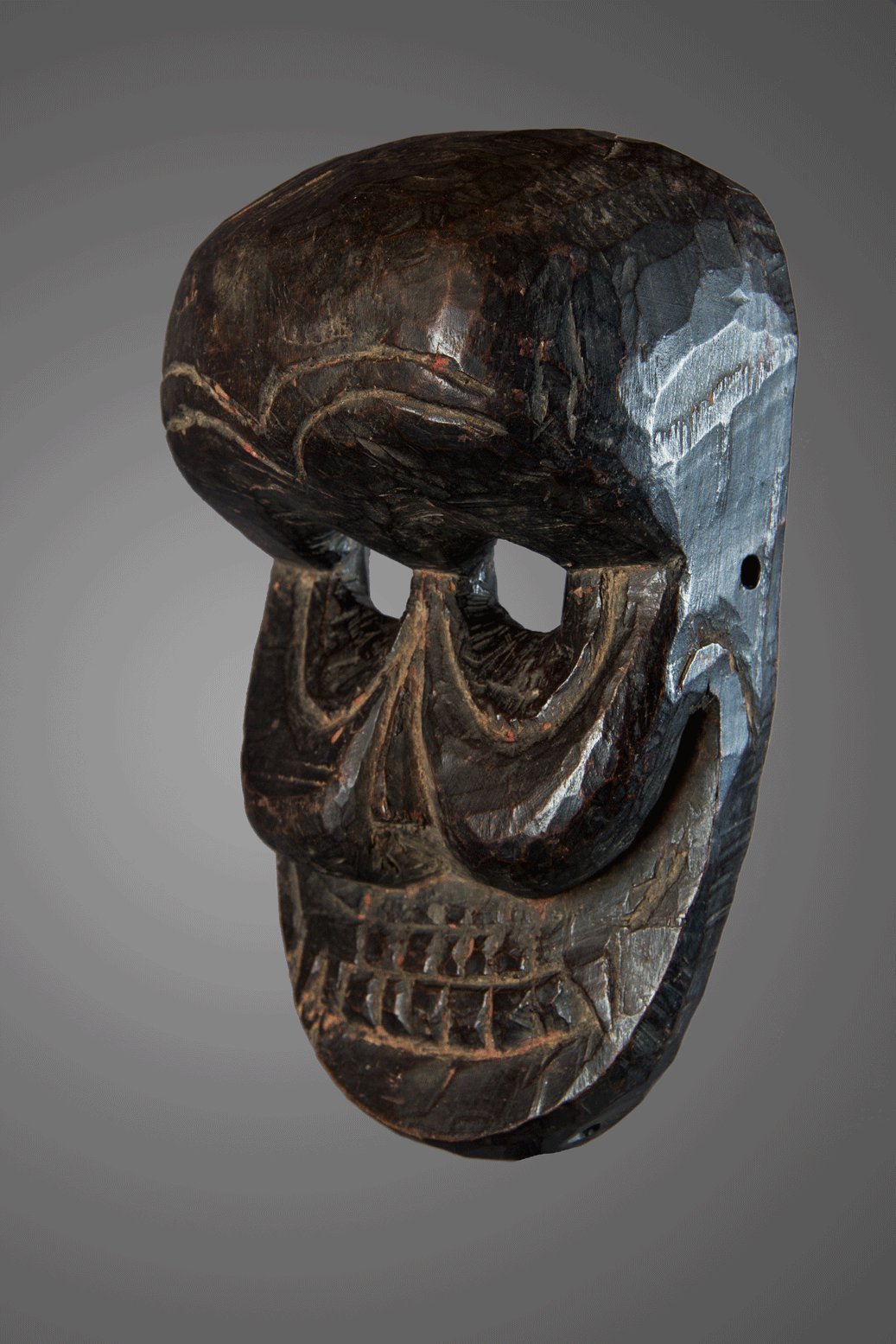 Black patina skull mask, India, Himalaya