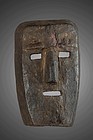 Primitive mask with dark brown encrusted patina, Himalayas, Népal