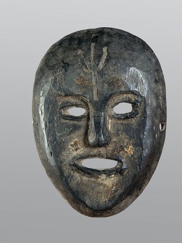 Black flat mask with a trisul carved on the front head