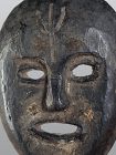 Black flat mask with a trisul carved on the front head