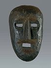 Black soot patina human face mask, Nepal