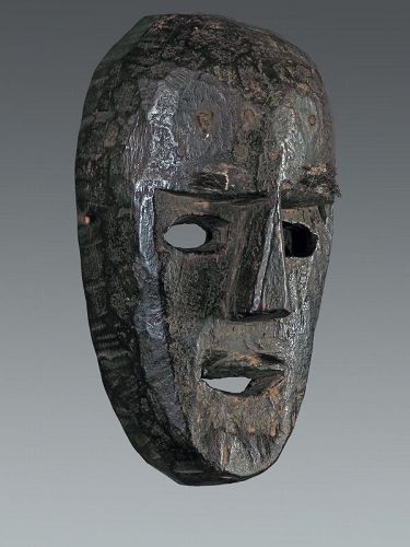 Old black patina anthropomorphic mask, Nepal, Himalaya