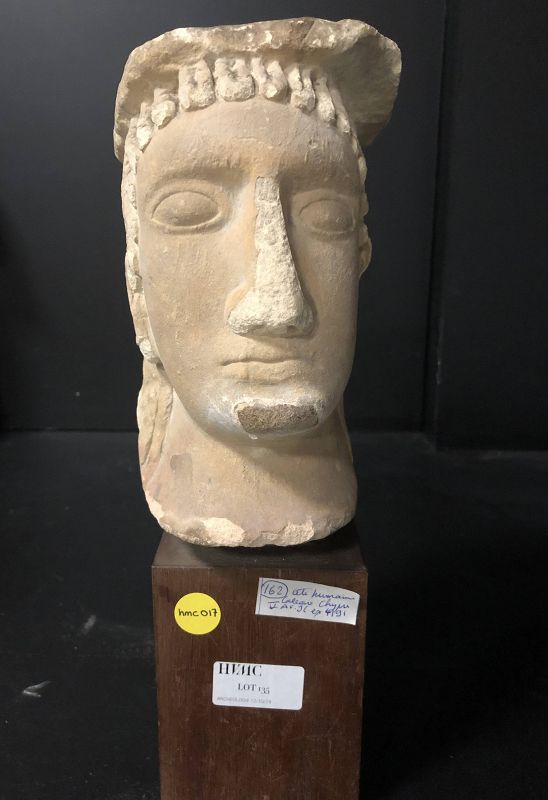A cypriot limestone masculine head, 5th Century BC