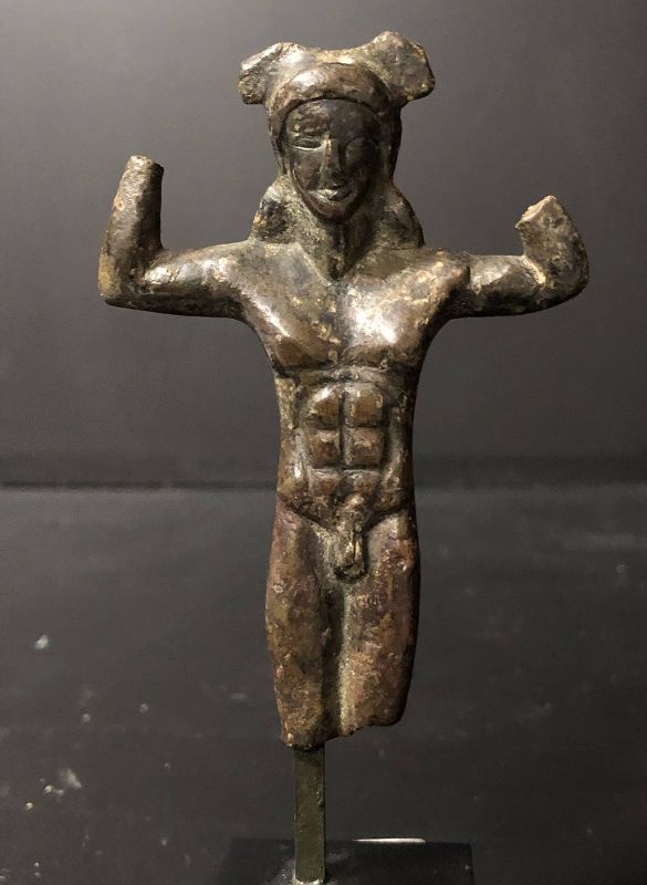 An etruscan bronze handle in a form of a kouros, 5th century