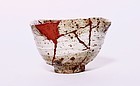 An Old Hakeme Karatsu Tea Bowl with Red Lacquer Repairs