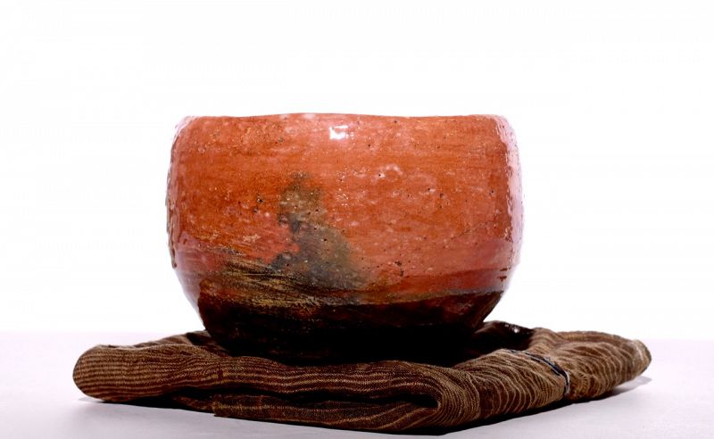 A Red Raku Tea Bowl by Dohachi II (Ninami)