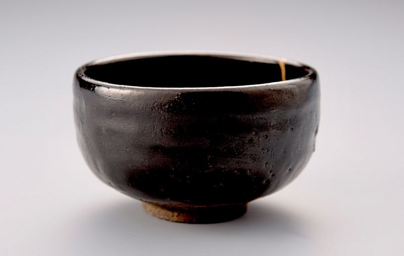 A Kuro-Raku Tea Bowl w/ Gold Repair by Eiraku 11